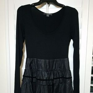 Long-sleeve black and shiny frilly dress